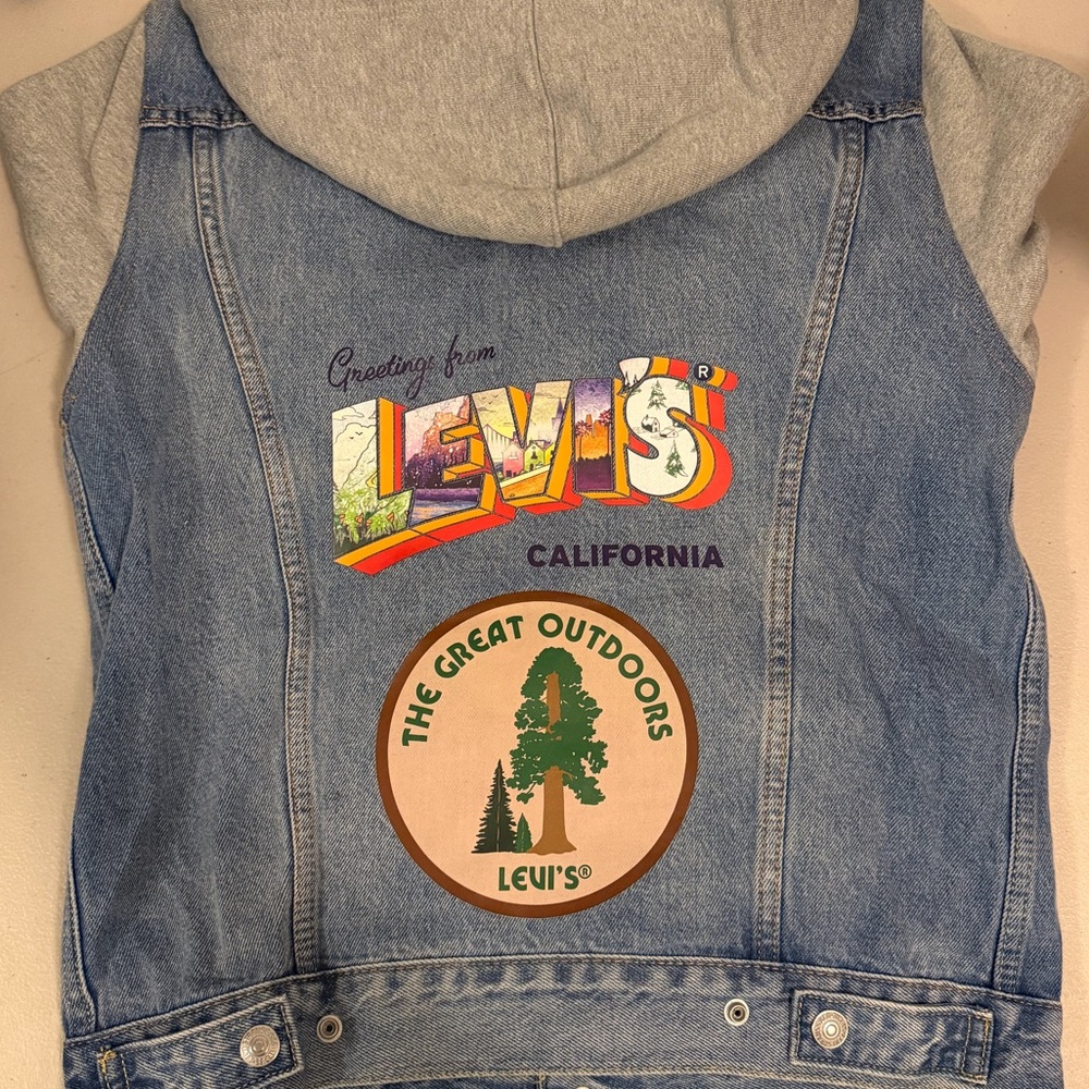 Levi's Light Blue Denim Jacket with Gray Hoodie and Patch Accents